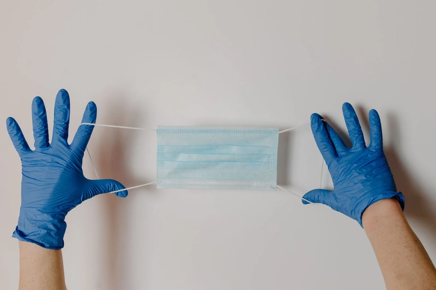 Surgical gloves and a disposable face mask